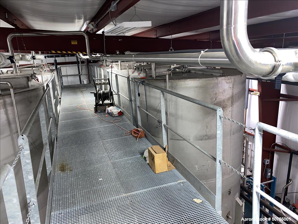 Used Vertical Tank, Approximately 5,000 Gallon, 304 Stainless Steel, 100.5" diameter, 120.5" straight side height. 64.5" conical bottom. 217" overall height. 3" center bottom discharge. The side has ...