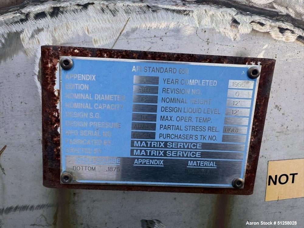 Used 10,000 Gallon Vertical Stainless Steel Tank. 316L Stainless Steel. Approximately 12' diameter x 12' tall. Side manways. Flat top. Refurbished 1995.