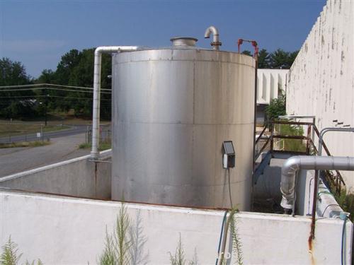 USED: 7500 gallon, 304 stainless steel, vertical tank. Slight dishtop, flat bottom, 10' diameter x 13' overall height, insulated.Last used to store latex.