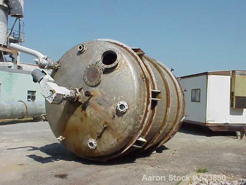 USED: 8000 Gallon vertical, stainless steel, tank. 10'6" diameter x12'. Dish top and bottom. Chemineer mixer model 3HTN-5, 5 hp, 1750rpmi, 68 rpm. Top manway, 4" CBO. Lug mount.