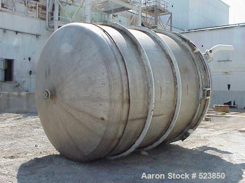 USED: 8000 Gallon vertical, stainless steel, tank. 10'6" diameter x12'. Dish top and bottom. Chemineer mixer model 3HTN-5, 5 hp, 1750rpmi, 68 rpm. Top manway, 4" CBO. Lug mount.
