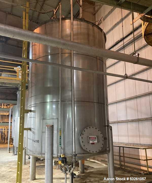 Used Approximate 9000 gallon Stainless Steel Storage Tank With 5 HP Centrifugal Pump, V-4780. approximate 120' X 15' T/T. Misc. top inlets. Cone bottom with center bottom outlet. Bottom side manway. ...