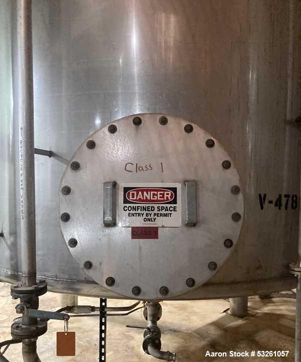 Used Approximate 9000 gallon Stainless Steel Storage Tank With 5 HP Centrifugal Pump, V-4780. approximate 120' X 15' T/T. Misc. top inlets. Cone bottom with center bottom outlet. Bottom side manway. ...