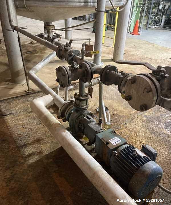 Used Approximate 9000 gallon Stainless Steel Storage Tank With 5 HP Centrifugal Pump, V-4780. approximate 120' X 15' T/T. Misc. top inlets. Cone bottom with center bottom outlet. Bottom side manway. ...
