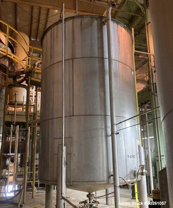 Used Approximate 9000 gallon Stainless Steel Storage Tank With 5 HP Centrifugal Pump, V-4780. approximate 120' X 15' T/T. Misc. top inlets. Cone bottom with center bottom outlet. Bottom side manway. ...