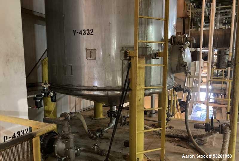 Used Approximate 6,750 gallon Stainless Steel Tank With Diaphragm Pump, V-4332. Flat top with misc. inlets & openings. Cone bottom with center bottom outlet. Side bottom manway. Has stainless steel l...