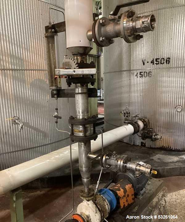 Used Approximate 8000 gallon Stainless Steel Mixing Tank With Centrifugal Pump, V-4506. Flat top with misc. top inlets. Cone bottom with center bottom outlet. Insulated shell. Top entering Chemineer ...