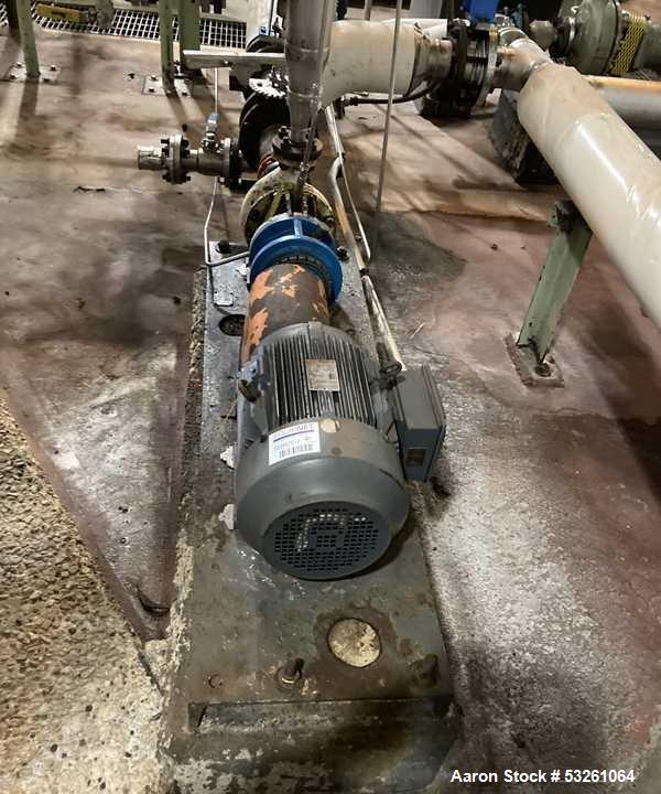 Used Approximate 8000 gallon Stainless Steel Mixing Tank With Centrifugal Pump, V-4506. Flat top with misc. top inlets. Cone bottom with center bottom outlet. Insulated shell. Top entering Chemineer ...