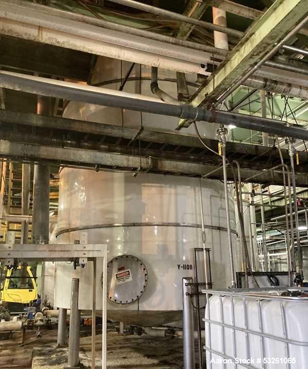Used Approximate 8000 gallon Stainless Steel Mixing Tank With Centrifugal Pump, V-4505. Flat top with misc. top inlets. Cone bottom with center bottom outlet. Insulated shell. Top entering Chemineer ...