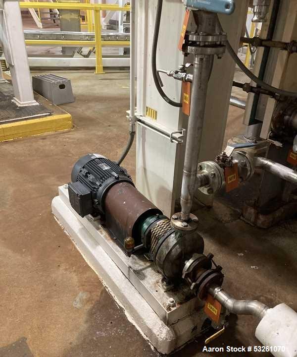 Used Approximate 6,000 gallon Stainless Steel Tank With A Worthington 7.5 HP Centrifugal Pump, V-1110. approximate 6000 gallon Flat top with misc. inlets. Cone bottom with center bottom outlet. Worth...
