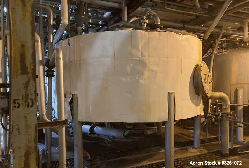 Used Approximate 5200 gallon Stainless Steel Mixing Tank. 12C. Includes centrifugal pump.