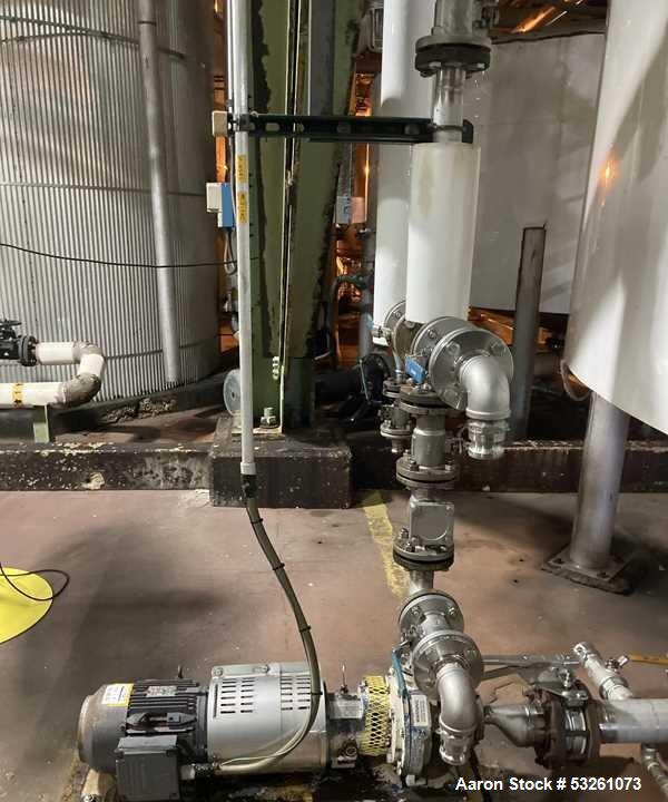 Used Approximate 5200 gallon Stainless Steel Mixing Tank, V-4541. With Centrifugal pump, 60/50 HZ, 1745-1450 RPM, 230/460V. Griswold S/N 0030022629. Tom 2014. Model S-AA-11062.