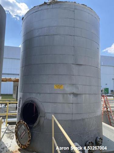 approximately 9000 gallon stainless steel vertical storage tank.