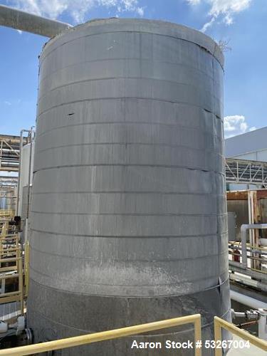 approximately 9000 gallon stainless steel vertical storage tank.