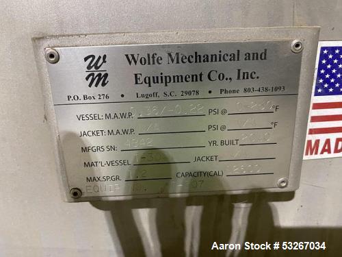 Wolfe Mechanical approximately 12,600 gallon 304L stainless steel vertical tank.