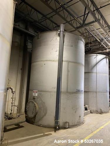 Wolfe Mechanical approximately 10,000 gallon 304L stainless steel vertical tank.