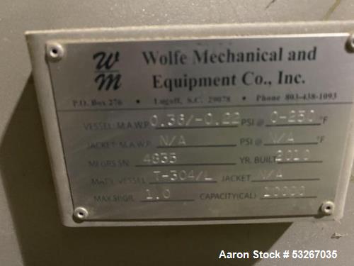 Wolfe Mechanical approximately 10,000 gallon 304L stainless steel vertical tank.
