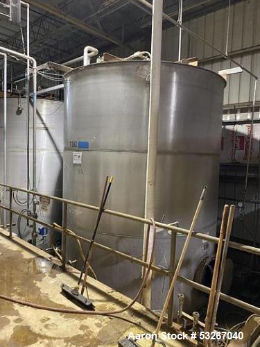 Wolfe Mechanical approximately 12,600 gallon 304L stainless steel vertical tank.