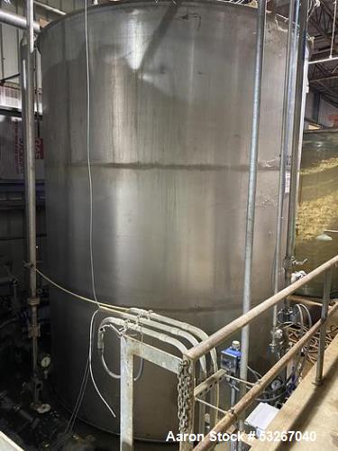 Wolfe Mechanical approximately 12,600 gallon 304L stainless steel vertical tank.