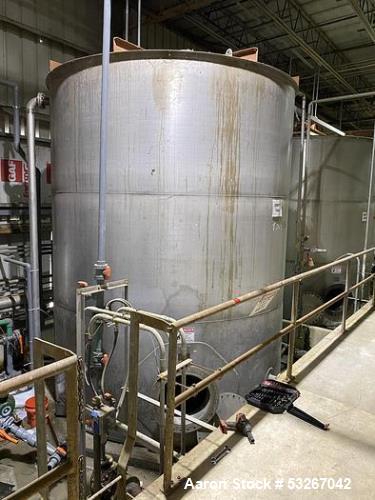 Wolfe Mechanical approximately 12,600 gallon 304L stainless steel vertical tank.