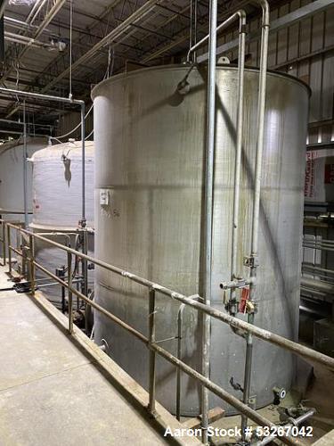 Wolfe Mechanical approximately 12,600 gallon 304L stainless steel vertical tank.