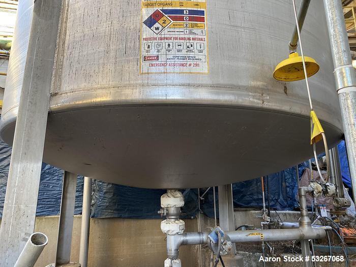 Used Vertical Stainless Steel Tank, Approx. 6,000 gallon capacity.