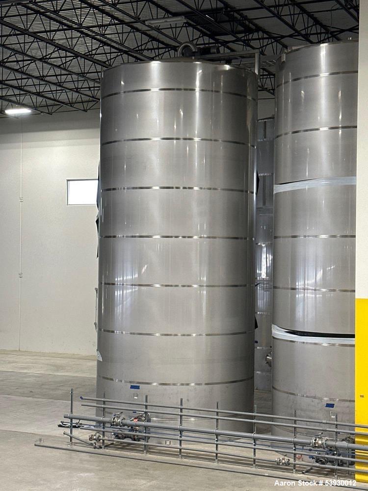 Used 2022 Single wall 35,000 Gallon stainless steel vertical silo, 14ft Diameter X 30ft High, front manways, (TK 112), with top-mounted agitator