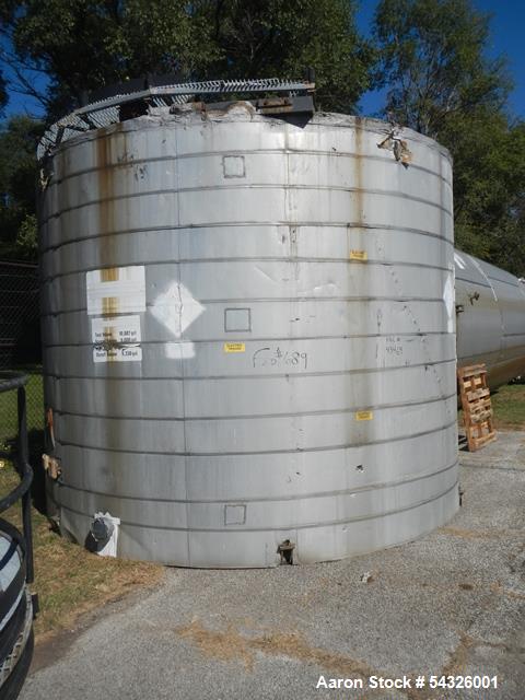 Used 11,000 gallon stainless steel storage tank, approximately 12'6" diameter X 11' straight side, dome top, flat bottom, approximately 24" top manway, 1.5" side nozzle, (2) 3" side bottom outlets.
