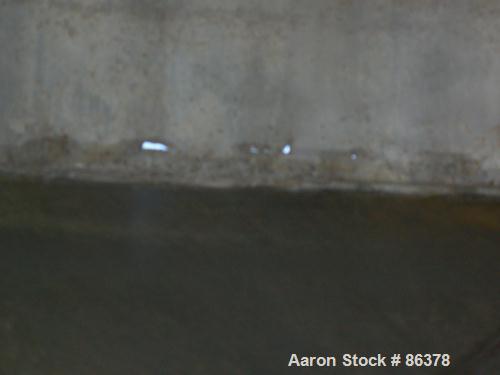 USED: Tank, 10,000 gallon, 304 stainless steel, vertical. Approximate 11' diameter x 14' straight side. Coned top, sloped bottom. Openings: top 18" manway with cover, 3", 6", 4"; 16" x 20" side oval ...