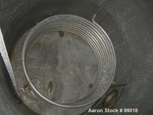 USED: Tank, 11,700 gallon, 304 stainless steel, vertical. Approximately 132" diameter x 198" straight side. Dished top, flat bottom. 10 turns of approximate 3" pipe coil. Openings: top 1-1/2", 4", 6"...