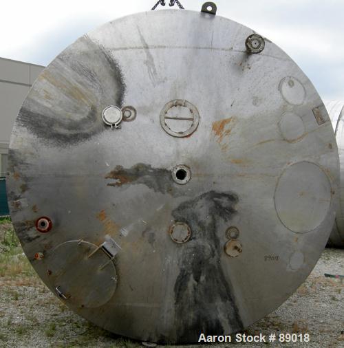 USED: Tank, 11,700 gallon, 304 stainless steel, vertical. Approximately 132" diameter x 198" straight side. Dished top, flat bottom. 10 turns of approximate 3" pipe coil. Openings: top 1-1/2", 4", 6"...