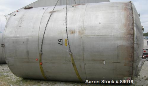 USED: Tank, 11,700 gallon, 304 stainless steel, vertical. Approximately 132" diameter x 198" straight side. Dished top, flat bottom. 10 turns of approximate 3" pipe coil. Openings: top 1-1/2", 4", 6"...