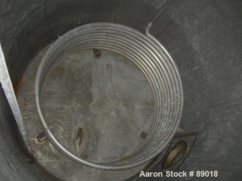 USED: Tank, 11,700 gallon, 304 stainless steel, vertical. Approximately 132" diameter x 198" straight side. Dished top, flat bottom. 10 turns of approximate 3" pipe coil. Openings: top 1-1/2", 4", 6"...