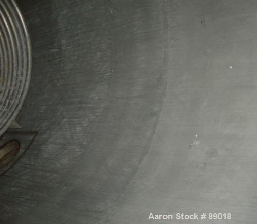USED: Tank, 11,700 gallon, 304 stainless steel, vertical. Approximately 132" diameter x 198" straight side. Dished top, flat bottom. 10 turns of approximate 3" pipe coil. Openings: top 1-1/2", 4", 6"...
