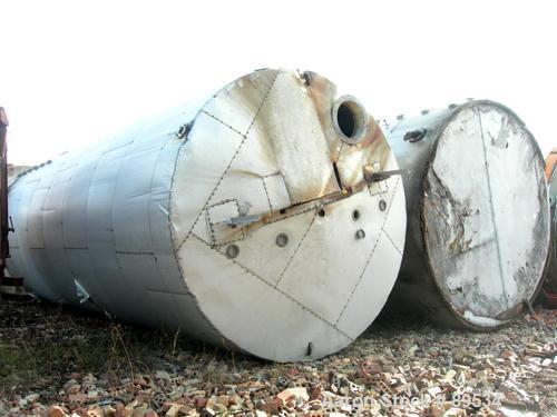 USED: Tank, 25,000 gallon, 316 stainless steel, vertical. 144" diameter x 360" straight side. Conical top, flat bottom. Openings: (1) 18" top, (1) 18" side manway, (1) 6" side bottom outlet.