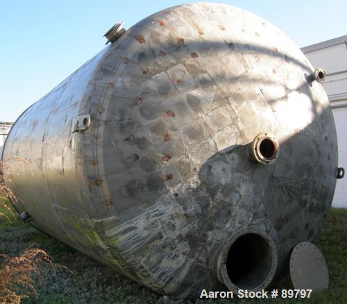 USED: Approximate 14,000 gallon stainless steel storage tank. Vertical, dished heads, 5' skirt bottom. 11'6" diameter x 17' straight side. Top openings: (1) 24" manway with cover, (1) 8", (1) 3"; var...