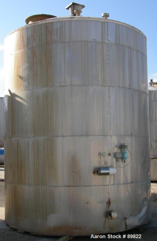 USED: Tank, 7,000 gallon, stainless steel, insulated, vertical. 10' diameter x 12' straight side. Dish top, flat bottom. Top openings: manway with cover, misc top openings. Shaft and impeller driven ...