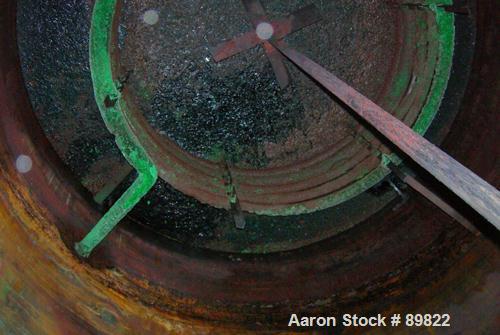 USED: Tank, 7,000 gallon, stainless steel, insulated, vertical. 10' diameter x 12' straight side. Dish top, flat bottom. Top openings: manway with cover, misc top openings. Shaft and impeller driven ...