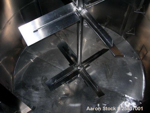 Used Tank, 10,000 Gallon 304 Stainless Steel Tank, Approx. 12' diameter x 11' 6" straight side.  Straight Side, Coned Top & Bottom, 40 HP Agitator with Turbines, Mounted on Legs.