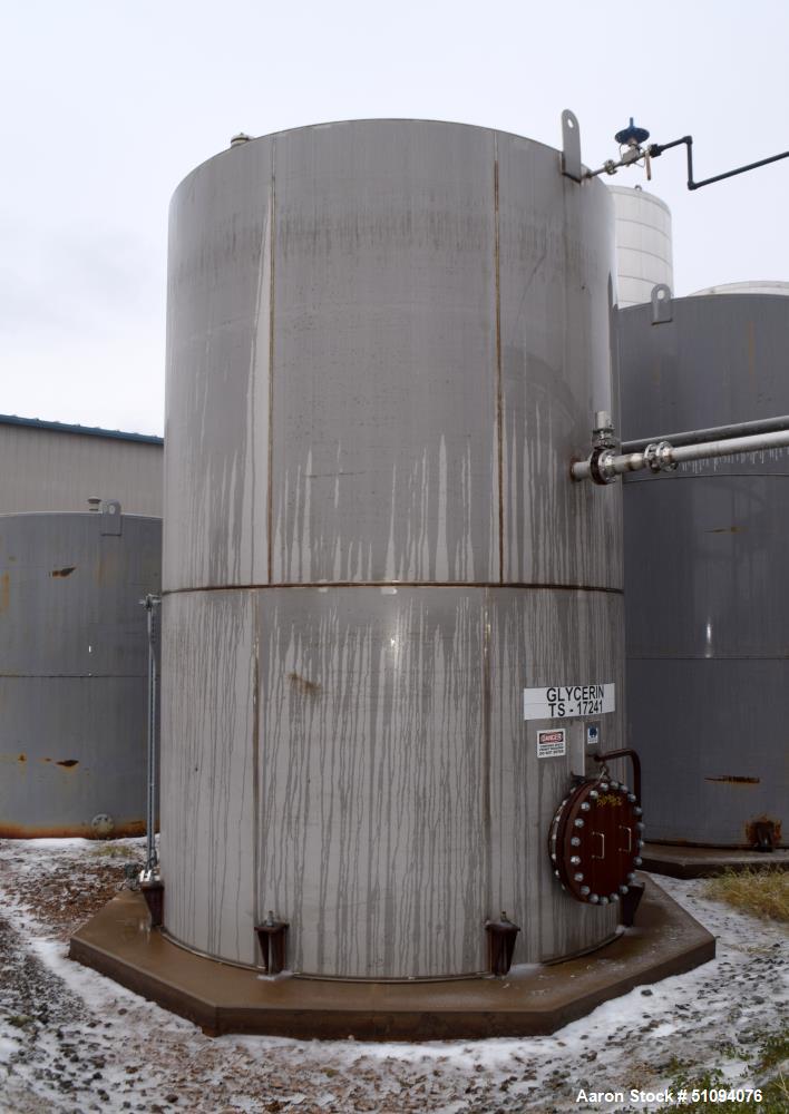 Used A&B Process Tank, 15,000 Gallon, 304L Stainless Steel, Vertical. Approximate 144" diameter x 216" straight side, top, flat bottom.  Openings top 3", 4" side (5) 2", 24" man way with davit arm an...