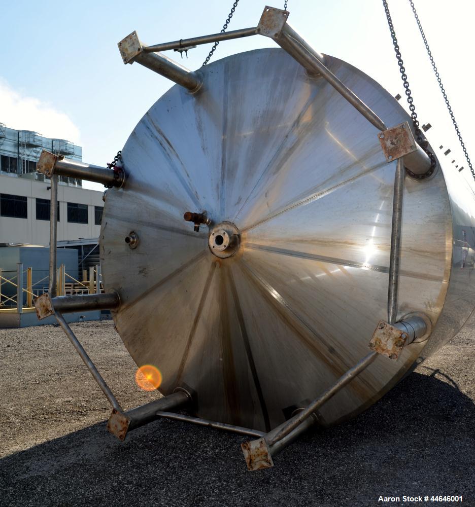 Used APV Crepaco Tank, Approximately 11,000 gallons, 304 Stainless Steel, Vertical. Approximate 138” diameter x 164” straight side, dished top, coned bottom. Approximate 60” wide section of bottom si...