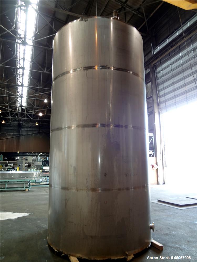 Used Acme Industrial Tank, 6000 Gallon, 304 Stainless Steel, Vertical. Approximate 192" Straight Side x 96" Diameter. Partial cone top, flat bottom. Top openings: 4", (3) 3", 6". Side openings: 24" m...