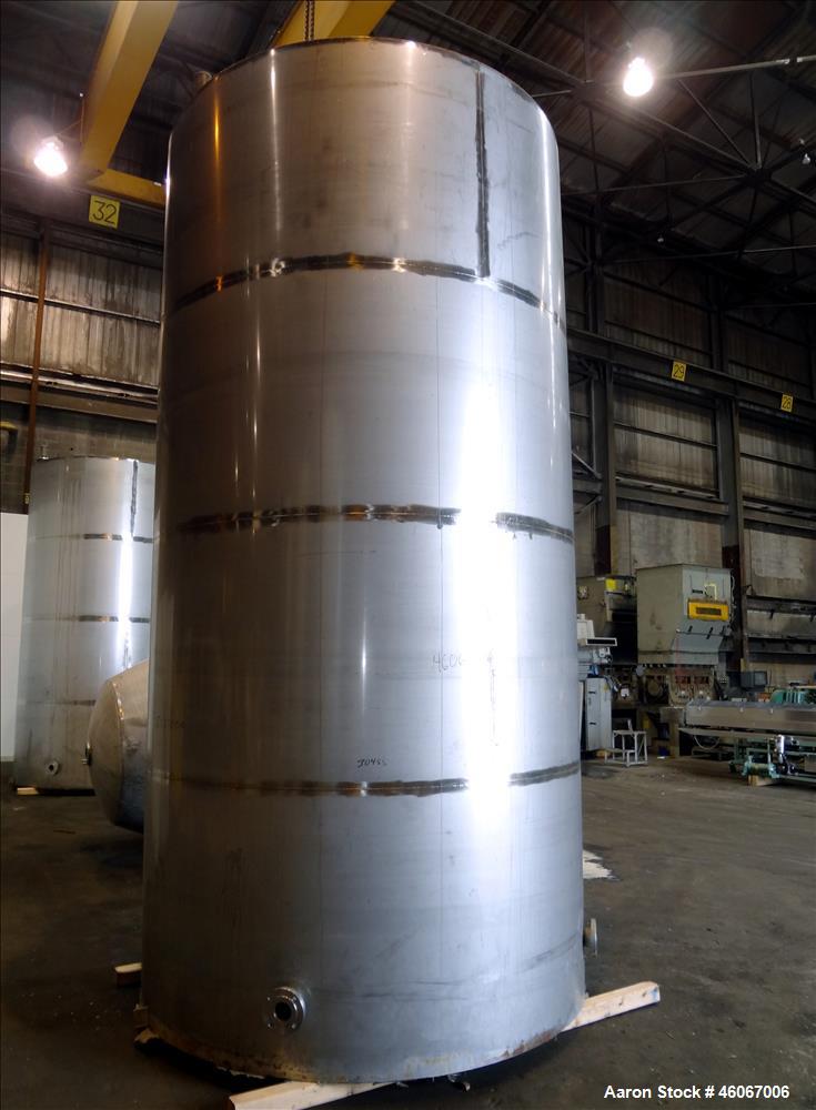 Used Acme Industrial Tank, 6000 Gallon, 304 Stainless Steel, Vertical. Approximate 192" Straight Side x 96" Diameter. Partial cone top, flat bottom. Top openings: 4", (3) 3", 6". Side openings: 24" m...