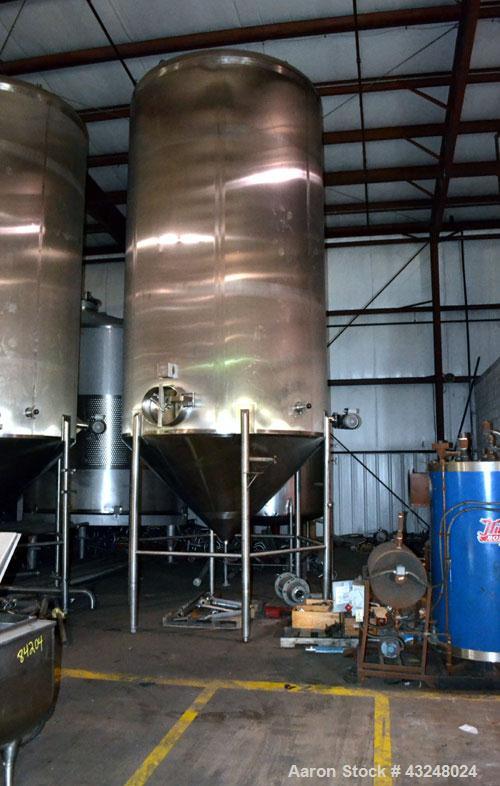 Used Apache Tank, 6500 Gallon, 316 Stainless Steel, Vertical. Approximate 102” diameter x 172” straight side. Dished top, 70” coned bottom. Side entering agitator with a 3 blade prop, driven by a 3hp...