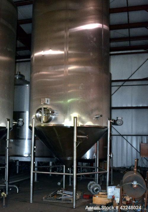 Used Apache Tank, 6500 Gallon, 316 Stainless Steel, Vertical. Approximate 102” diameter x 172” straight side. Dished top, 70” coned bottom. Side entering agitator with a 3 blade prop, driven by a 3hp...