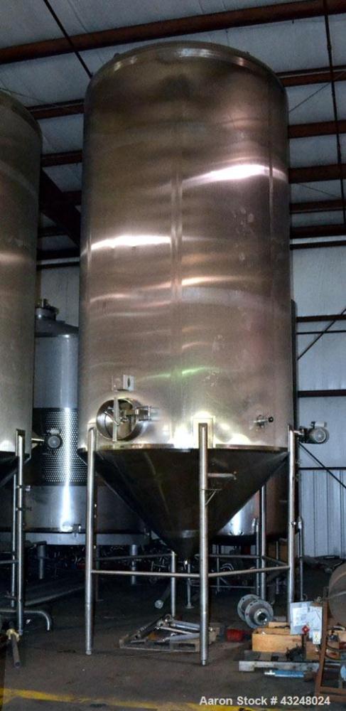 Used Apache Tank, 6500 Gallon, 316 Stainless Steel, Vertical. Approximate 102” diameter x 172” straight side. Dished top, 70” coned bottom. Side entering agitator with a 3 blade prop, driven by a 3hp...