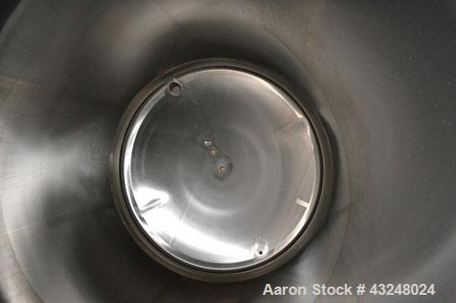 Used Apache Tank, 6500 Gallon, 316 Stainless Steel, Vertical. Approximate 102” diameter x 172” straight side. Dished top, 70” coned bottom. Side entering agitator with a 3 blade prop, driven by a 3hp...