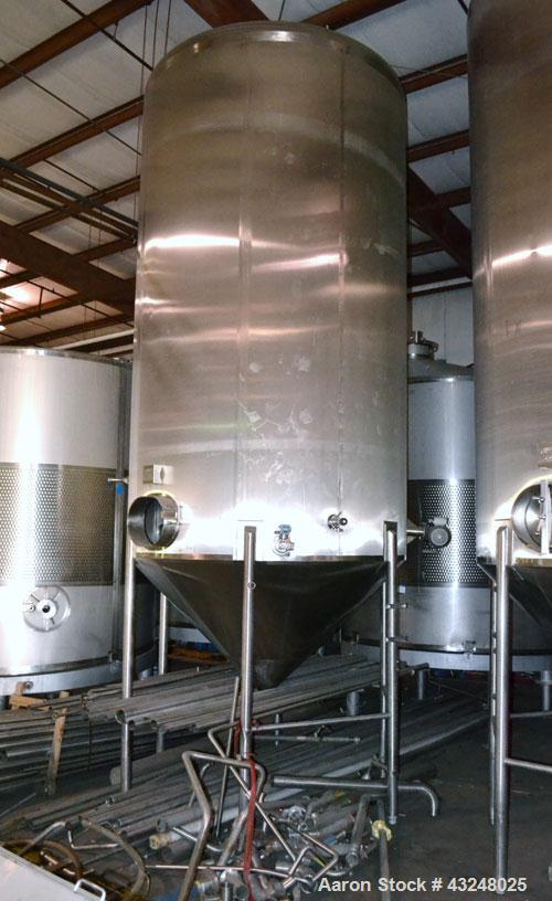 Used Apache Tank, 6500 Gallon, 316 Stainless Steel, Vertical. Approximate 102” diameter x 172” straight side. Dished top, 70” coned bottom. Side entering agitator with a 3 blade prop, driven by a 3hp...