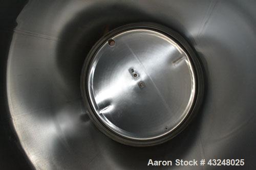 Used Apache Tank, 6500 Gallon, 316 Stainless Steel, Vertical. Approximate 102” diameter x 172” straight side. Dished top, 70” coned bottom. Side entering agitator with a 3 blade prop, driven by a 3hp...