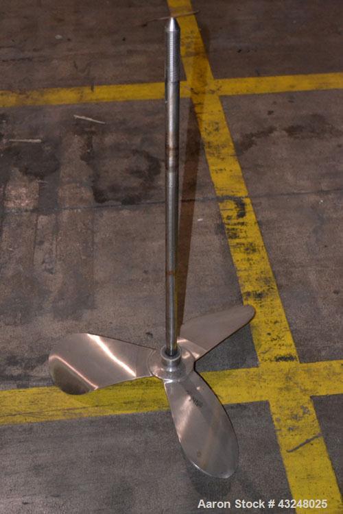 Used Apache Tank, 6500 Gallon, 316 Stainless Steel, Vertical. Approximate 102” diameter x 172” straight side. Dished top, 70” coned bottom. Side entering agitator with a 3 blade prop, driven by a 3hp...